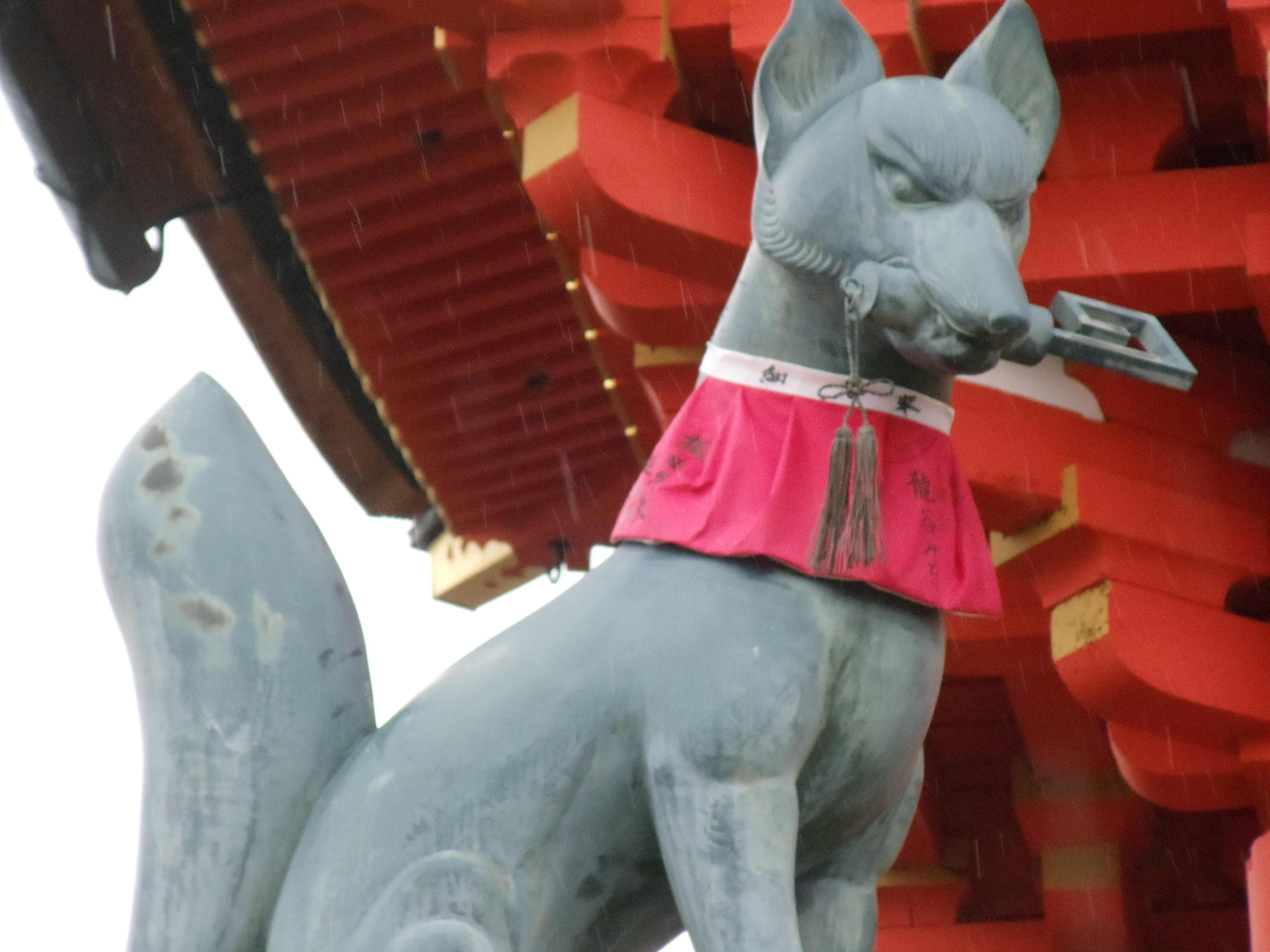 inari statue holding a key